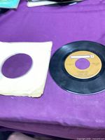 Record with sleeve front view
