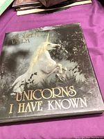 Front cover of hardcover with unicorn illustration and title