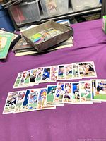 Spread of Upper Deck football cards laid out on table