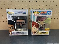 Front view of both boxed figures showing characters and numbering