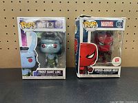 Front view of both Funko Pop boxes showing characters, numbers and Walgreens exclusive sticker