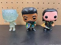 Front view of all three Funko Pop figures