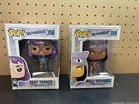Front view of both boxed figures