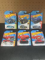 Group shot of six Hot Wheels blister cards
