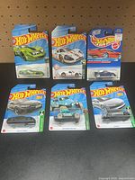 Group shot of all six carded Hot Wheels cars