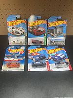 All six Hot Wheels cars on cards