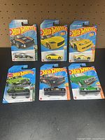 All six sealed Hot Wheels cars on display