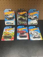 Front view of all six carded Hot Wheels cars