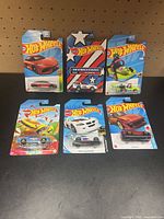 Group shot of six carded Hot Wheels cars