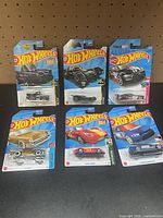 All six packaged Hot Wheels cars displayed