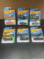 All six carded cars on table