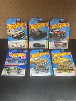 Front view of all six sealed Hot Wheels cars