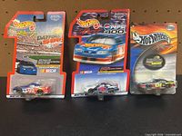 All three sealed Hot Wheels NASCAR cars showing fronts of cards