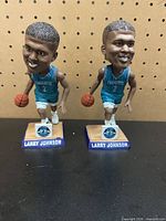 Both Larry Johnson bobbleheads front view