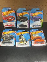 Full set of six carded vehicles displayed front-on