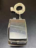 Top view of massager with coiled cord
