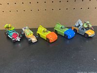 Five TMNT die-cast vehicles lined up