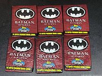 Front view of six sealed Batman Returns packs