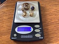 Lot on digital scale showing total weight 8.9 g
