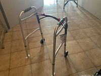 Full view of Drive aluminum walker standing on tile floor