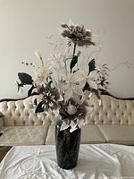 Full view of floral arrangement and vase