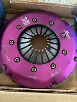 Purple pressure plate with branding and specs