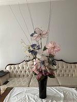 Full view of floral arrangement showing flowers and vase