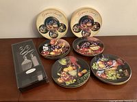 Eight fruit pattern plates, two outer boxes, boxed cake server set