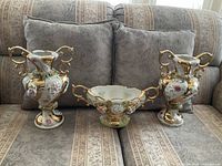 Full view of both vases and center bowl on sofa