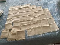 Overhead view of entire 10-piece linen set laid out to show size differences.