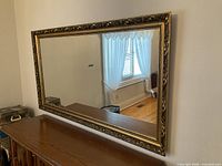 Full view of mirror on wall showing shape and size
