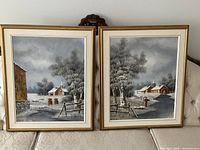 Both framed paintings on sofa showing overall appearance