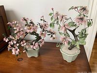 Both artificial bonsai trees side by side showing overall form and pots