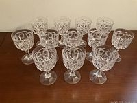 All 12 crystal wine glasses arranged on table