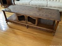 Full view of coffee table top, legs and shelves