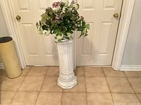 Pedestal with floral arrangement front view