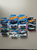Group shot of all seven sealed Hot Wheels cars on cards