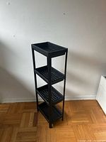 Front angled view showing full height and four tiers