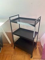 front angled view showing overall cart with three shelves and wheels
