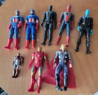 All eight Marvel action figures laid out on tabletop