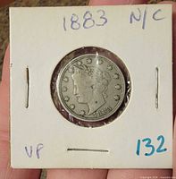Obverse of 1883 Liberty Head V Nickel in flip holder showing date and VF notation