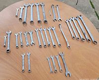Full layout of 32 wrenches on tabletop