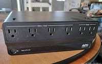 Front view showing 6 outlets and APC logo