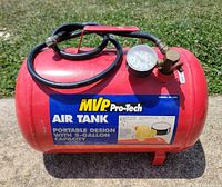 Overall view of MVP Pro-Tech red 5-gallon air tank with hose, gauge and valve