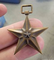 Front view of Bronze Star Medal pendant showing star design and suspension loop