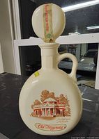 Front view showing Monticello graphic, stopper, handle