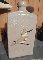 Front view showing kingfisher relief and bottle form