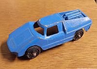 Blue die-cast Tootsietoy Fiat Abarth toy car, side and top view shows all tires and paint wear