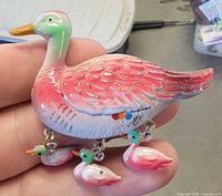 front view showing painted duck and dangling ducklings