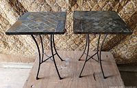 Both square slate top side tables showing overall design and metal frames